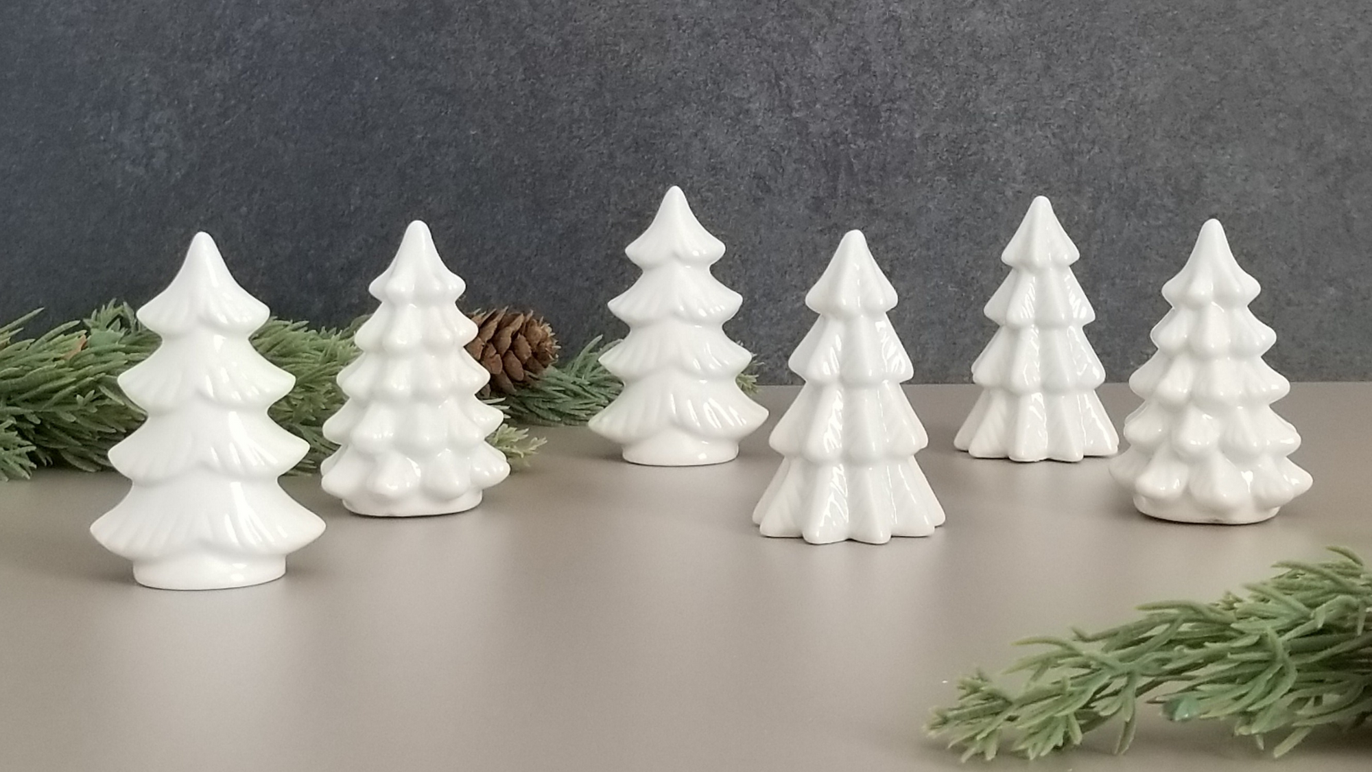Inspiration Behind the Holiday Collection blog post. Scene of small, white ceramic Christmas tree decor.